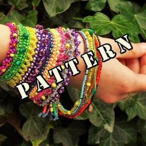 May include: A stack of colorful beaded bracelets with a variety of patterns and colors, including pink, green, yellow, purple, and blue. The bracelets are stacked on a person's wrist and the word "PATTERN" is superimposed on the image.