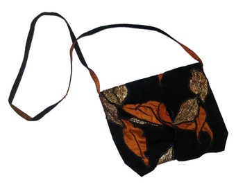 Small suede leather and silk handmade purse embellished with 3D handmade silk and thread work leaves.