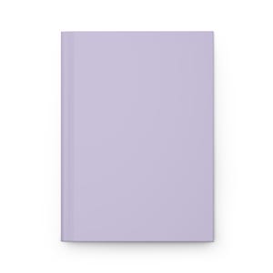 Puede incluir: Un cuaderno de color lavanda con una portada en blanco.