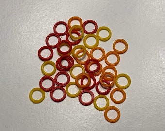 Fireball Circular Stitch Markers pk of 30 with a mystery lobster clamp stitch marker.