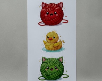 Bolas de lana de gato y pato