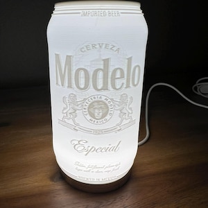May include: White light-up Modelo Especial beer can lamp. The can features the Modelo logo and text that reads "Cerveza Modelo", "Especial", and "Brewed in Mexico".