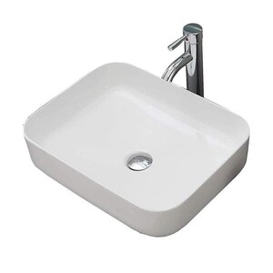 May include: A white, rectangular ceramic bathroom sink with rounded corners. A chrome faucet is mounted on the right side. The sink has a drain hole with a chrome drain cover. The design is modern and minimalist.