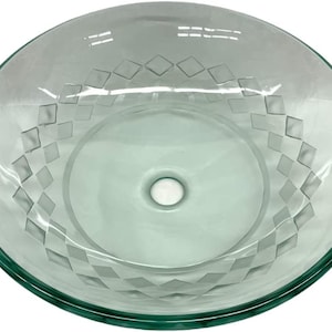 May include: A clear glass vessel sink with a diamond pattern etched into the surface. The sink has a round shape and a smooth, polished edge.