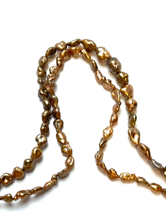 Stunning brown Tahitian pearl strands, enhanced