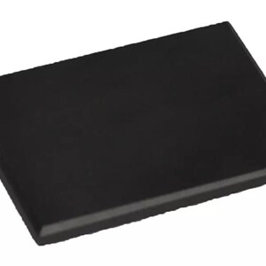 May include: A black rectangular slate tile, perfect for serving appetizers or displaying small items.