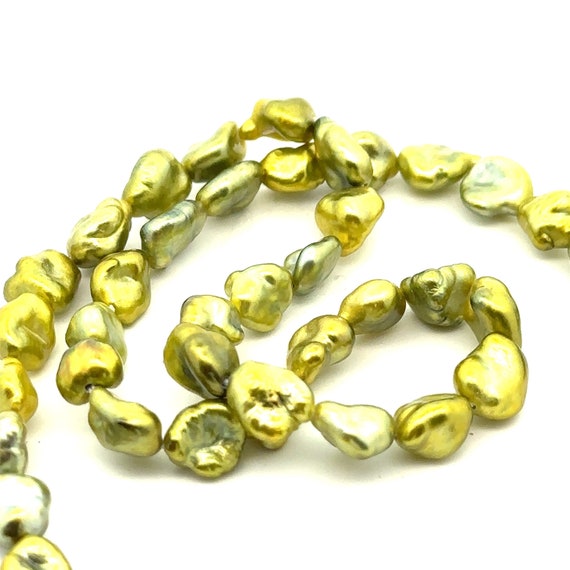 Green pistachio Tahitian keshi strand, High luster. SKU#PK6