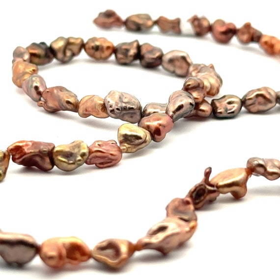 Chocolate Tahitian keshi pearl strand, 100% nacre