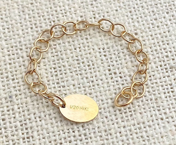 14k GF 2” Cable Chain Ext w/Oval Quality Tag