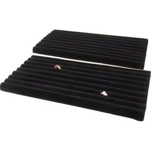 May include: Two black velvet ring display trays with 12 slots each. The trays are made of soft, black velvet and are perfect for displaying rings or other small jewelry.