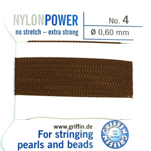 May include: Brown nylon string for stringing pearls and beads.  Nylon Power No. 4, 0.60 mm, no stretch, extra strong. Griffin since 1866, Germany.