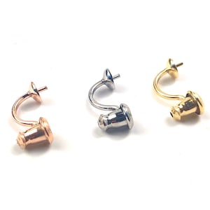 May include: Three earring findings in different metal finishes: gold, rose gold, and silver. Each finding has a curved hook and a small ball at the end.