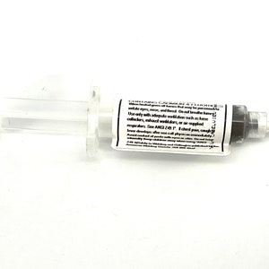 May include: A clear plastic syringe filled with a black substance. The label reads "COMPARED CAUTIONS ATTACHED" and includes safety instructions for use.  It states to use only with adequate ventilation such as fume collectors, exhaust ventilators, or air supplied respirators. See ANSI Z49.1. If chest pain, cough develops after use call physician immediately.
