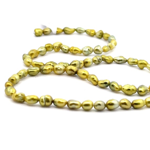 Green pistachio Tahitian keshi strand, High luster. SKU#PK8