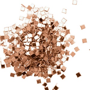 May include: A pile of rose gold confetti, made of small square pieces of metallic paper.
