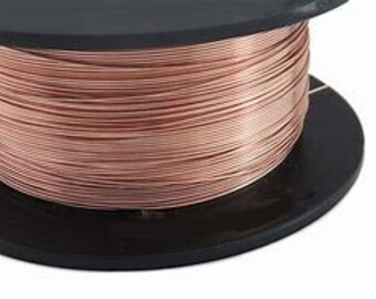 May include: A spool of rose gold colored wire. The wire is wound around a black plastic spool.