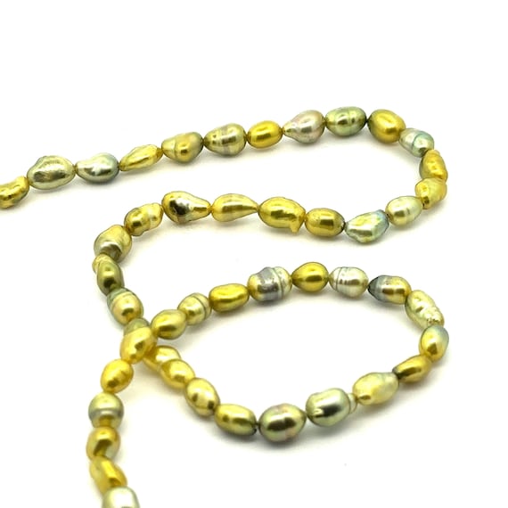 Green pistachio Tahitian keshi pearl strand, High luster. SKU#PK7