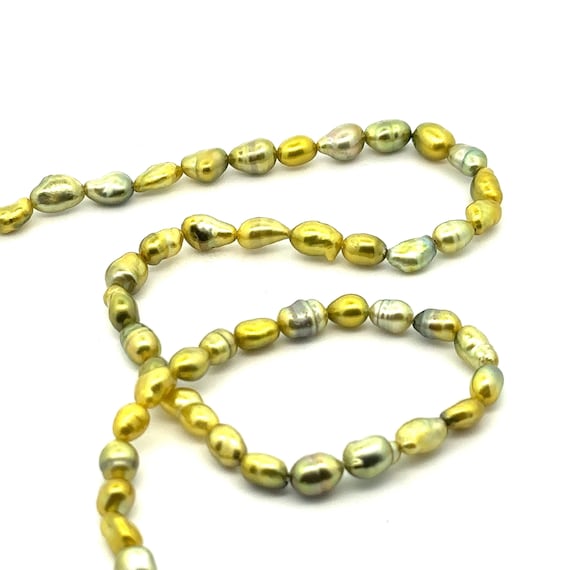 Green pistachio Tahitian keshi pearl strand, High luster. SKU#PK7