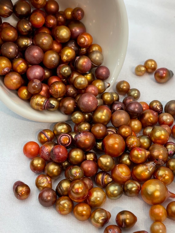 Beautiful citrus pearls, lovely orange enhanced Tahitian pearls
