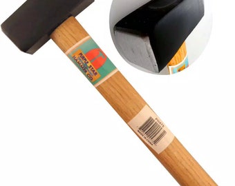 May include: A wooden-handled black hammer with a metal head. The hammer has a label that reads "Purple Star Hammer Co."