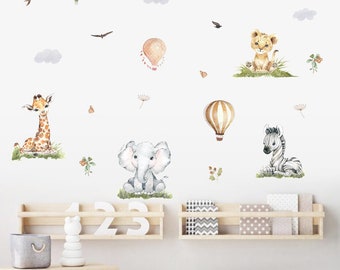 May include: A set of wall decals featuring a giraffe, elephant, lion, zebra, and hot air balloons. The decals are in a watercolor style and are perfect for a nursery or child's room.
