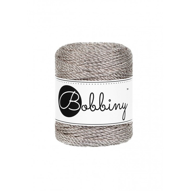 May include: A spool of gray and silver yarn with a white label that says "Bobbiny&trade;".