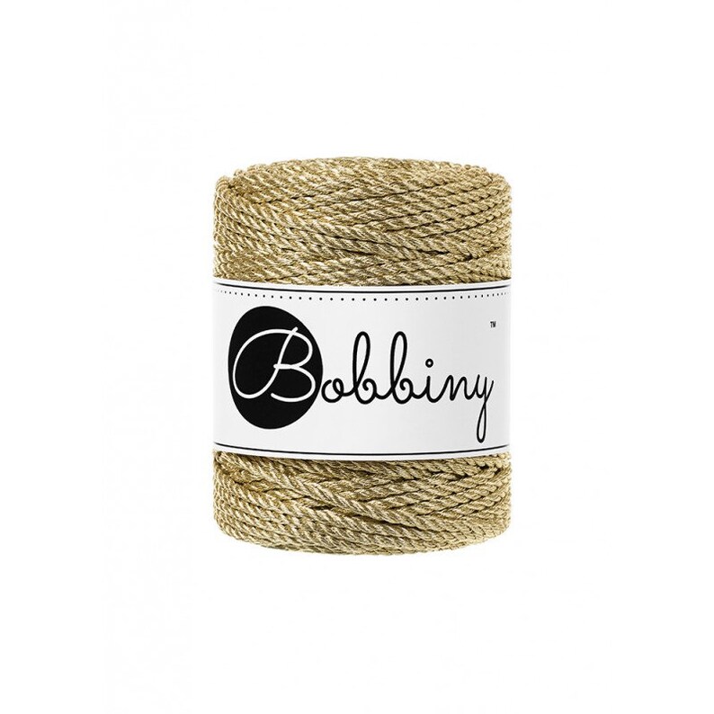 May include: A spool of gold metallic twine with a white label that says "Bobbiny&trade;".