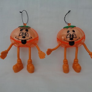 vintage 1998 set of 2 pumpkin Jack-o-Lantern Halloween themed bendable figures candy holder container- empty