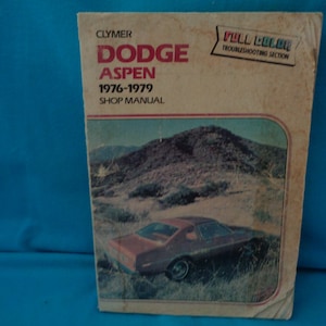 vintage 1980 Dodge Aspen 1976-1979 Shop Manual  book by Jim Combs in poor to good condition.