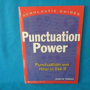 May include: A red and blue Scholastic Guides book titled "Punctuation Power: Punctuation and How to Use It" by Marvin Terban.