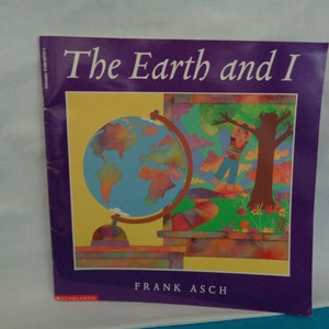 May include: A purple and yellow book titled "The Earth and I" by Frank Asch. The cover features a colorful globe and a child standing in a field.