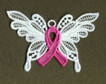 May include: White lace butterfly with a pink ribbon in the center. The butterfly is a symbol of hope and strength.