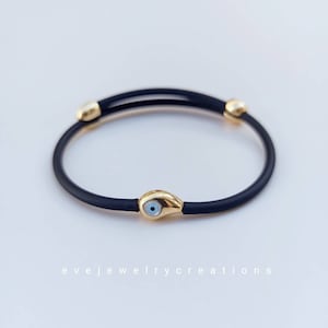 Unisex, adjustable, sterling silver, evil eye bracelet.