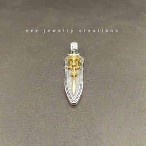 Hand made sterling silver Spartan helmet and sword pendant.