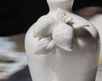 Ceramic bottle. Three-dimensional lemon