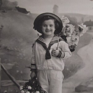 Antique postcard of a little boy with flowers, vintage postcard, old postcard, vintage postcards children