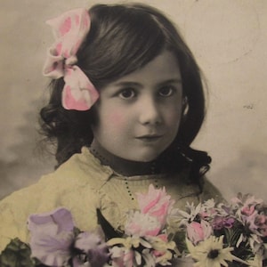 Vintage postcard of a lovely girl with some flowers, old postcard children, antique postcards girls