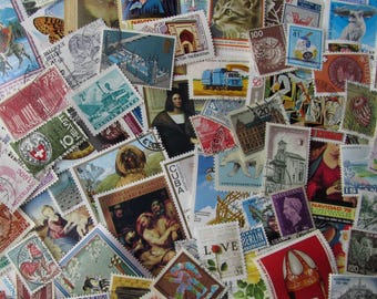 Worldwide off paper stamps, 25, 50, 75 or 100 vintage to modern used stamps from all over the world