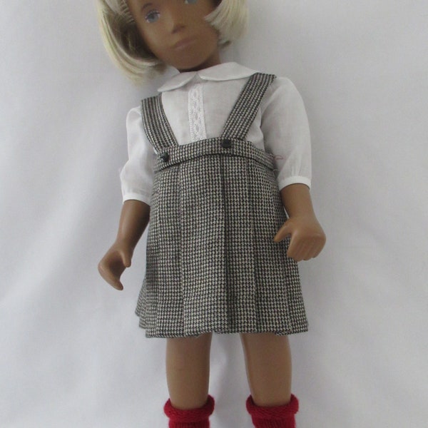 Child like clothes For Sasha dolls,  A white batiste heirloom blouse, and pleated skirt with suspenders, working buttons on both.  Enjoy!
