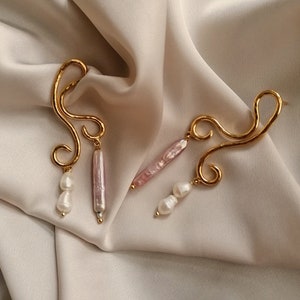 Abstract dangling earrings with natural pearls bathed in gold and made by hand in Paris, France