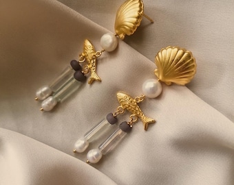 Ancient inspired shell earrings with pearls, fluorites and glass lilac beads bathed in gold or silver, made by hand in Paris, France