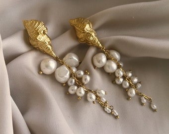 Beautiful dangling earrings with a cascade of pearls and a vintage shell, bathed in gold or silver, made by hand in Paris, France