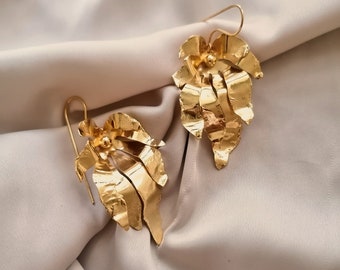 Big statement earrings in the shape of leaves, bathed in gold or silver and made by hand in Paris, France