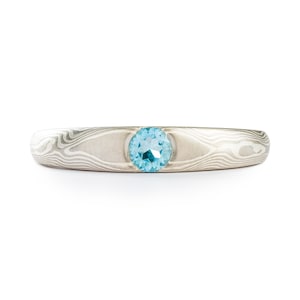 Mokume Gane Engagement Ring in Woodgrain Pattern with Cathedral Set Blue Topaz