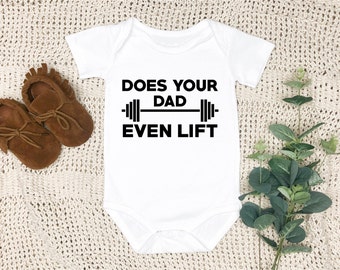 May include: White baby onesie with black text that reads "Does your dad even lift" with a barbell graphic.