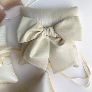 Sara Champagne Silk Ring Pillow With a Cream Dupioni Bow
