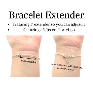 May include: A silver bracelet extender with a lobster claw clasp. The extender is 1 inch long and can be attached to any individual link on the extender.