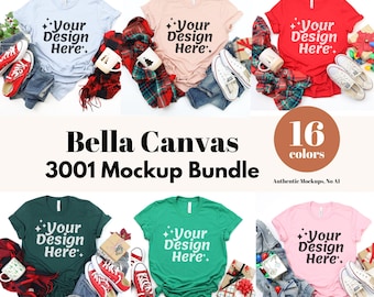 May include: A mockup bundle featuring Bella Canvas 3001 t-shirts in various colors, with the text "Your Design Here." displayed on each shirt. The image includes jeans, shoes, and holiday-themed accessories.