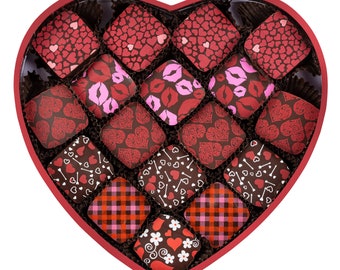 May include: A heart-shaped box of chocolates with a variety of designs, including hearts, lips, and bones. The box is red and the chocolates are dark brown.