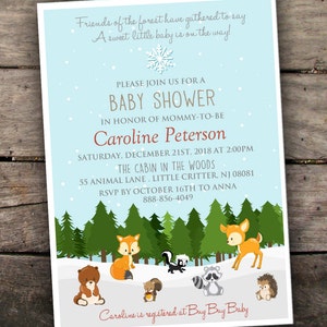 May include: A blue and white baby shower invitation with a winter woodland theme. The invitation features a snowflake, pine trees, and woodland animals like a fox, deer, raccoon, squirrel, and hedgehog. The text reads "Friends of the forest have gathered to say A sweet little baby is on the way!"  "Please join us for a baby shower in honor of mommy-to-be Caroline Peterson Saturday, December 21st, 2018 at 2:00pm The Cabin in the Woods 55 Animal Lane, Little Critter, NJ 08081 RSVP by October 16th to Anna 888-856-4049 Caroline is registered at Buy Buy Baby"